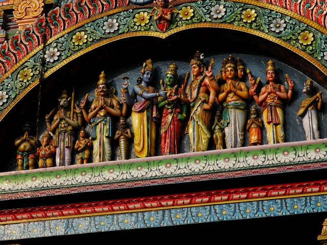  Lord Vishnu (left) giving his sister Meenakshi's hand away to Lord Shiva (right)