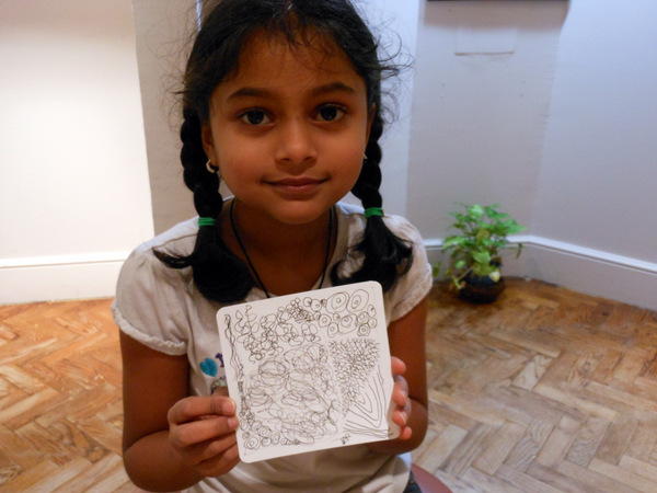 Here is a picture of my poor baby with her Zentangle tile she created while I painted...